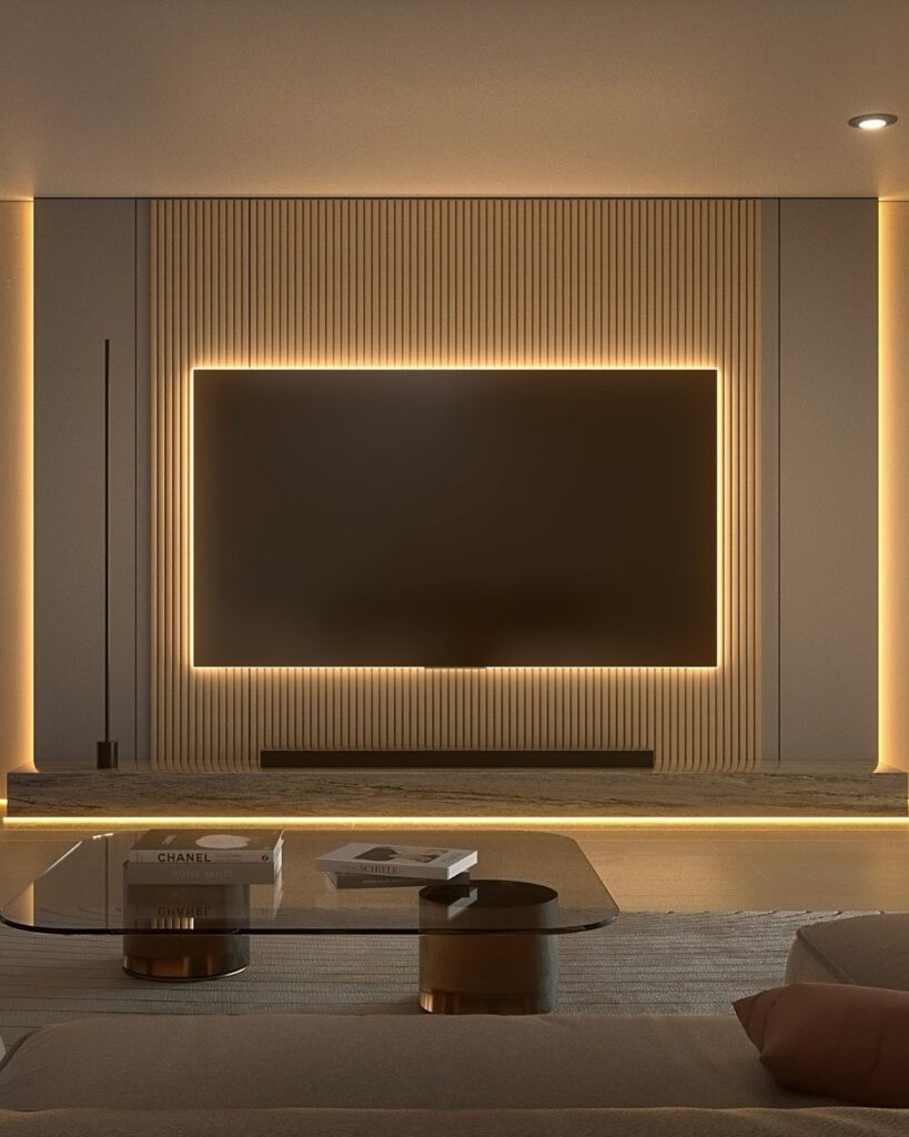 Television mounted on a slatted wall with warm yellow LED backlighting glowing behind it.
