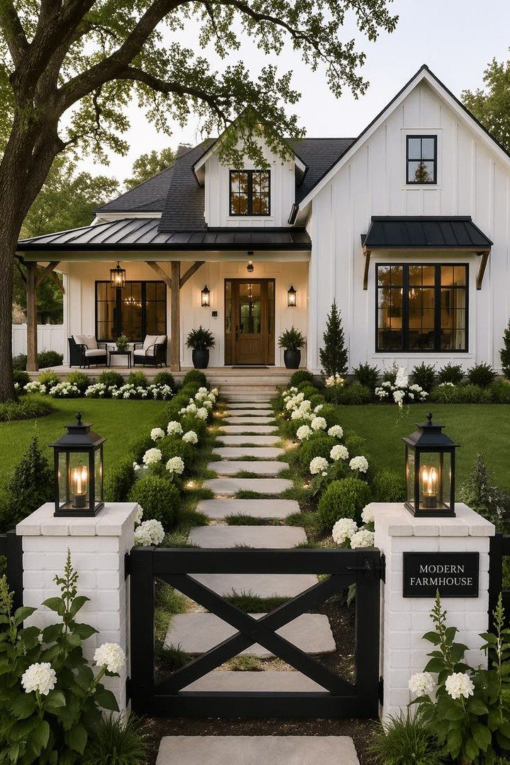 White modern farmhouse with a wooden front door and stone walkway garden path